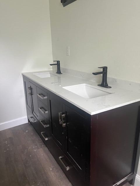 bathroom featuring vanity and hardwood / wood-style floors