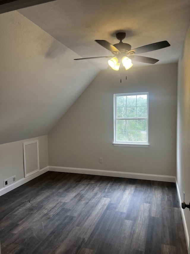 bonus room featuring ceiling fan, vaulted ceiling, and dark hardwood / wood-style floors