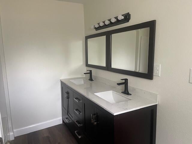 bathroom with vanity and hardwood / wood-style flooring