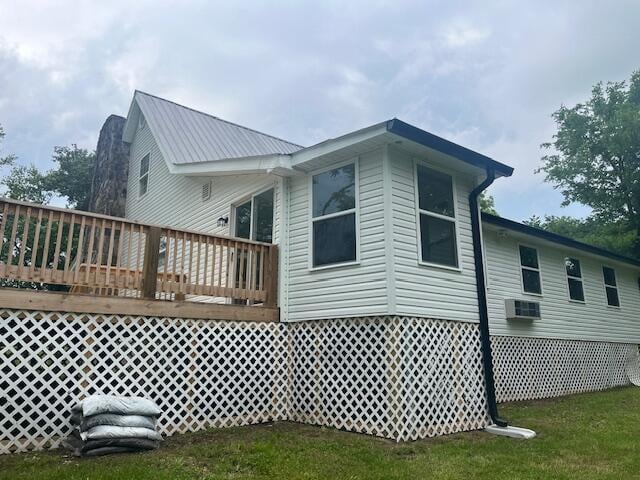 back of house with a wooden deck