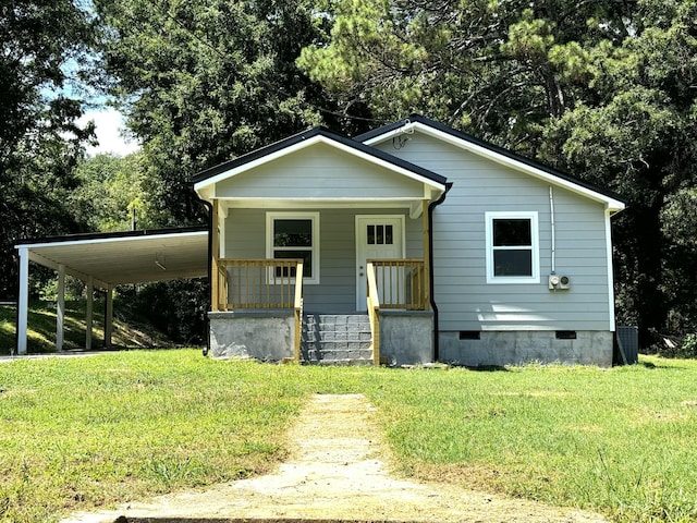 bungalow-style house with covered porch and a front lawn