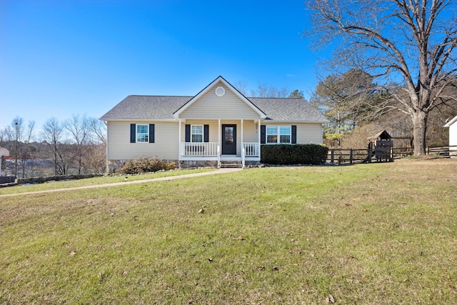 view of front of home featuring a front yard and covered porch