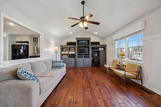 living room with lofted ceiling, dark wood-type flooring, and ceiling fan