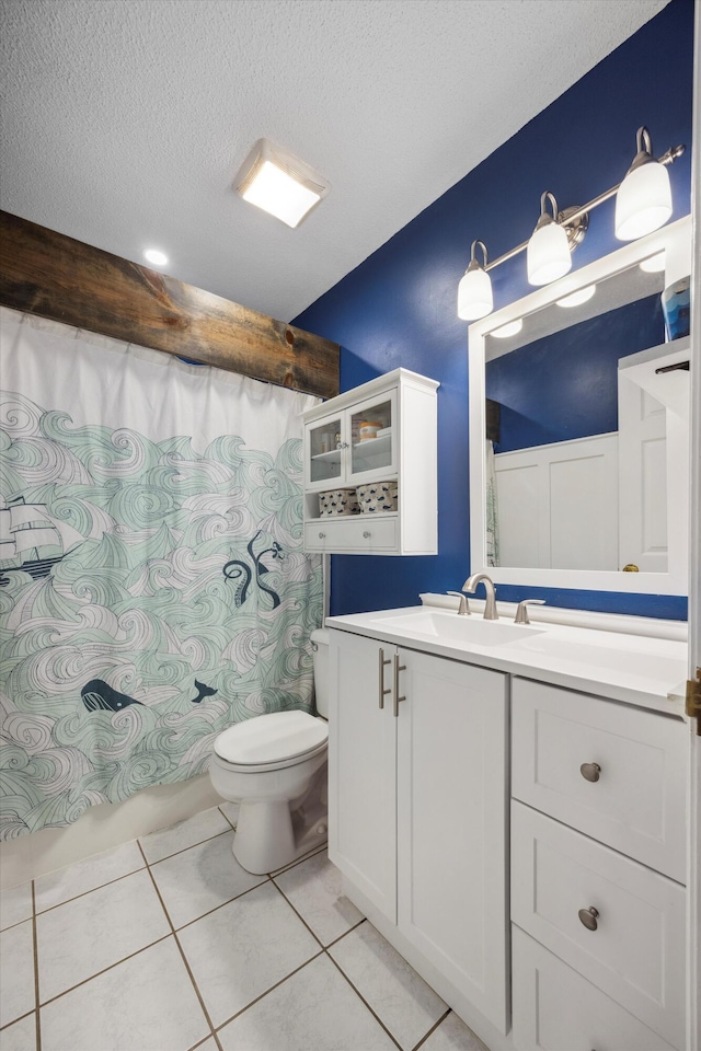 bathroom featuring a textured ceiling, tile patterned flooring, vanity, and toilet