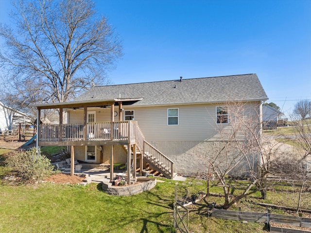 rear view of house with a yard, a deck, and a patio