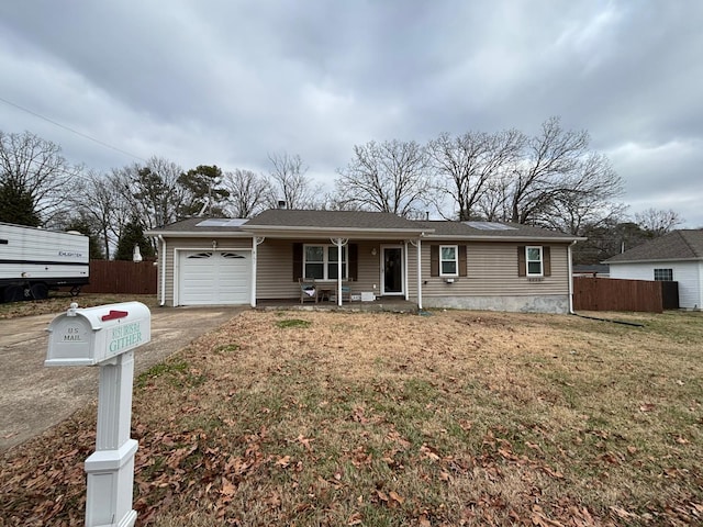 single story home with a front lawn and a garage