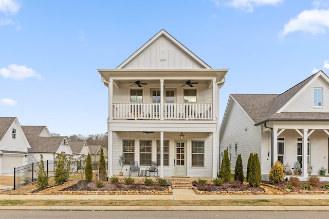 view of front facade with ceiling fan, a balcony, and a porch