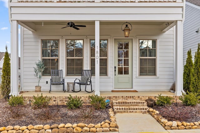 doorway to property featuring ceiling fan and covered porch