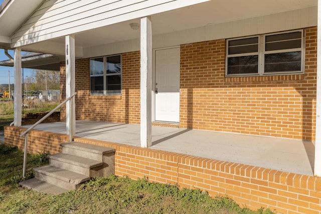 property entrance featuring covered porch