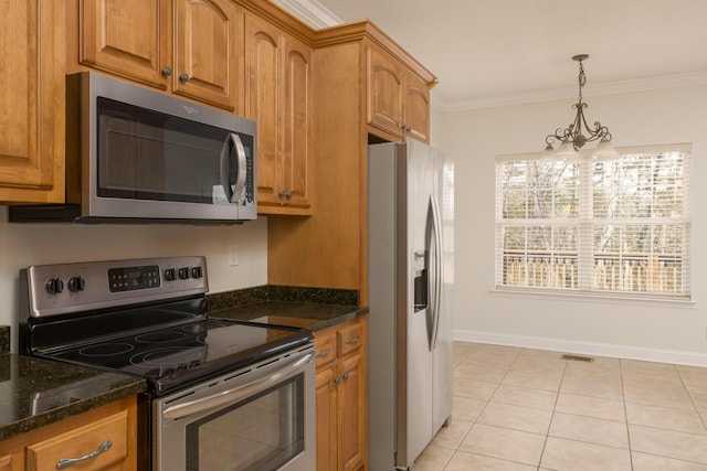 kitchen featuring stainless steel appliances, decorative light fixtures, an inviting chandelier, light tile patterned floors, and crown molding