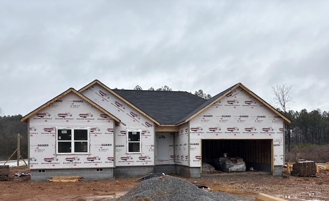 unfinished property with a garage