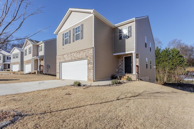 view of front of house with a front lawn and a garage