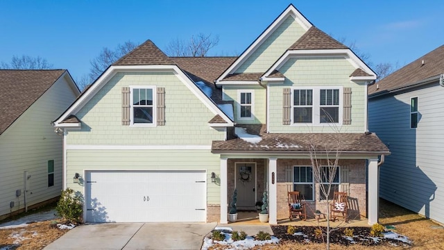 view of front of house with a garage and a porch