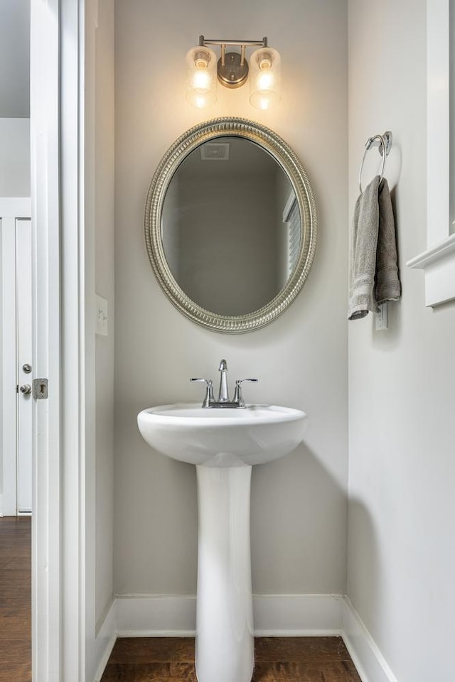 bathroom featuring hardwood / wood-style flooring and sink