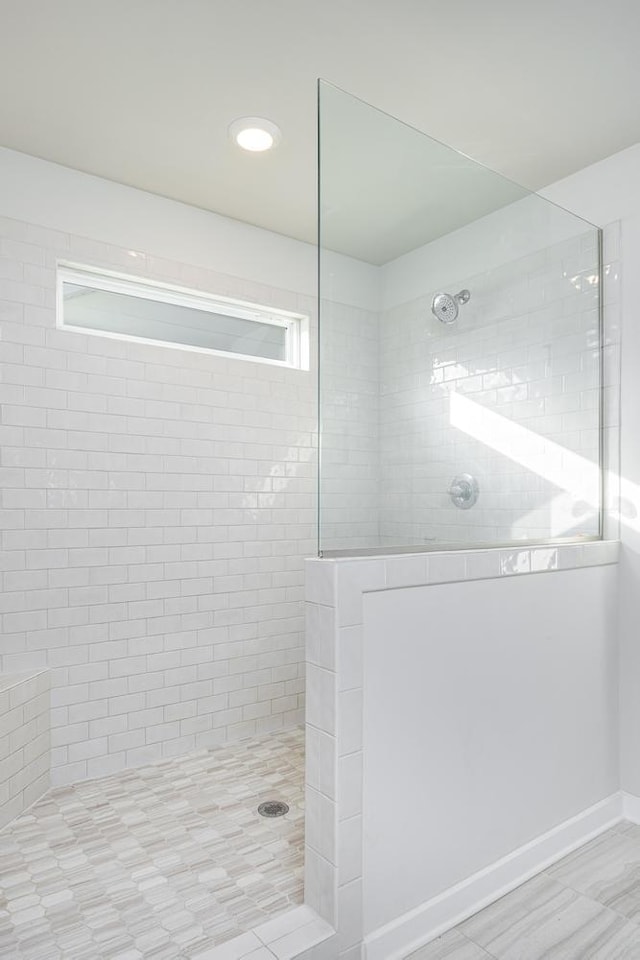 bathroom with tiled shower