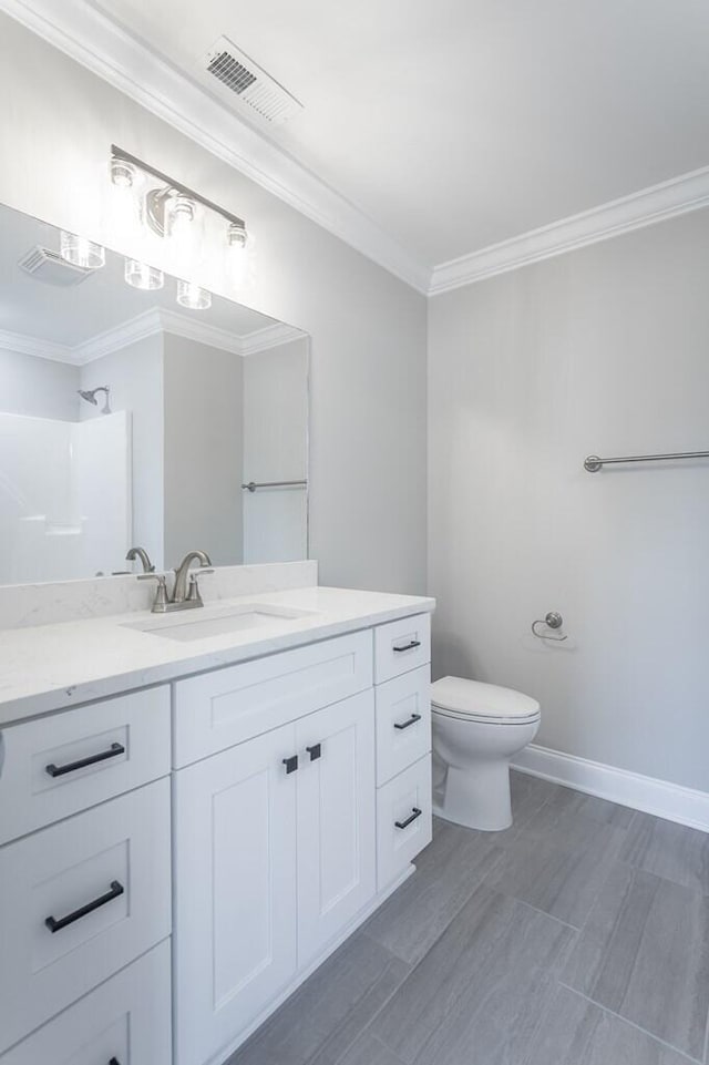 bathroom featuring toilet, crown molding, walk in shower, and vanity