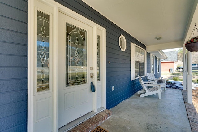 doorway to property featuring a porch