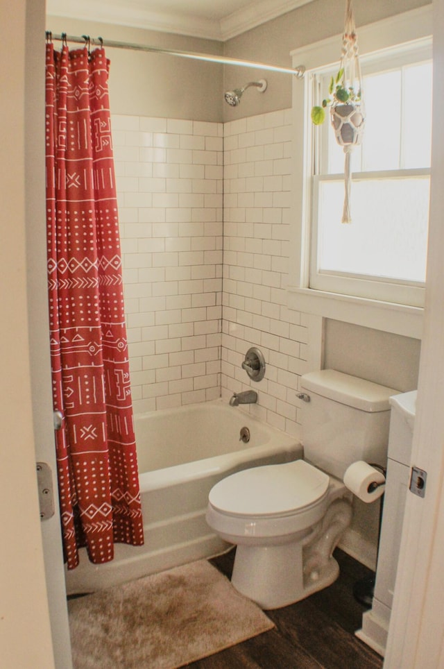 bathroom featuring toilet, shower / bath combo, hardwood / wood-style floors, and crown molding