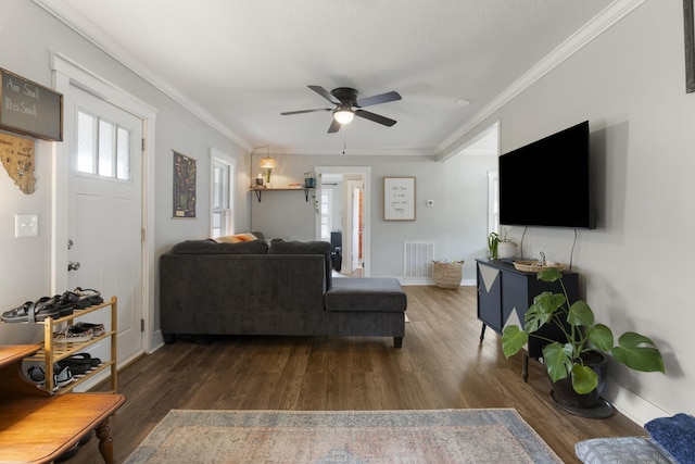 living room with ceiling fan, dark hardwood / wood-style floors, and ornamental molding