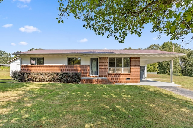 ranch-style home with a front lawn and a carport