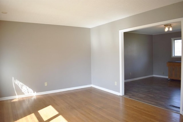 empty room featuring dark wood-type flooring