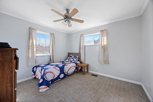 bedroom featuring multiple windows, ceiling fan, and carpet