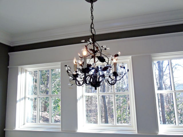 interior details featuring a notable chandelier