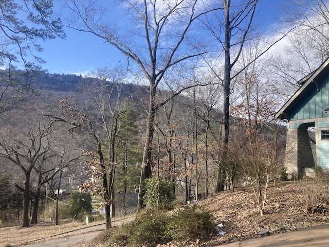 exterior space with a wooded view