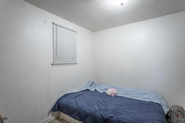 bedroom featuring a textured ceiling