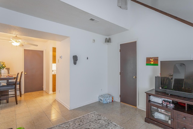 living room featuring ceiling fan and light tile patterned flooring