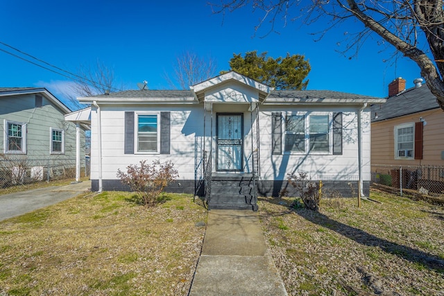 bungalow-style house with a front lawn