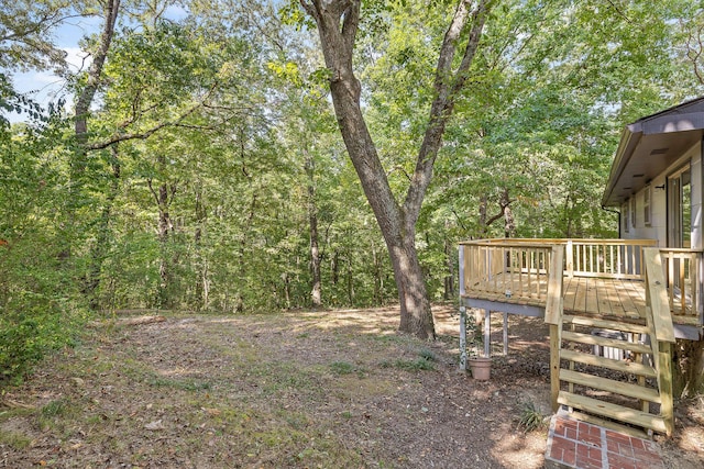 view of yard with a wooden deck