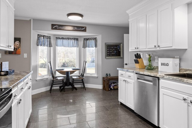 kitchen with dishwasher, baseboards, range, and granite tiled floors