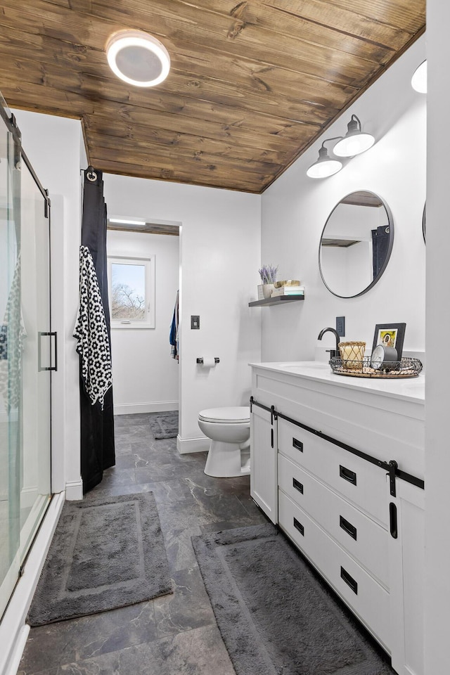 full bathroom featuring wood ceiling, a stall shower, vanity, toilet, and baseboards