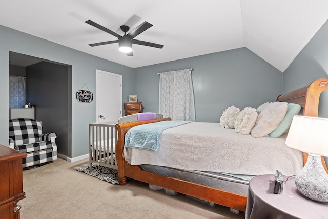 carpeted bedroom featuring lofted ceiling, ceiling fan, and baseboards