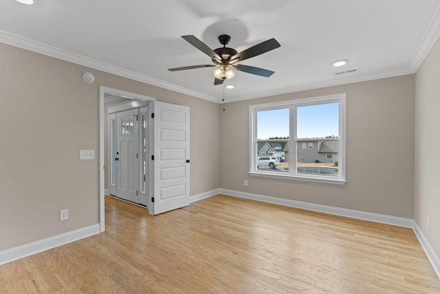 unfurnished room featuring ceiling fan, ornamental molding, and light hardwood / wood-style flooring