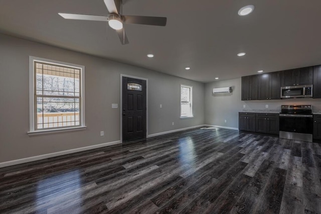 unfurnished living room with recessed lighting, baseboards, a ceiling fan, and dark wood-style flooring