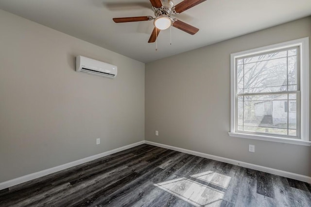 empty room featuring a ceiling fan, dark wood-style floors, baseboards, and a wall mounted AC