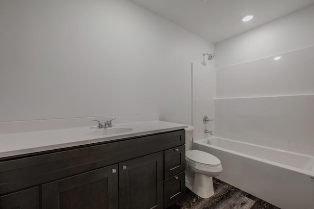 full bathroom with vanity, toilet, shower / bath combination, and wood finished floors