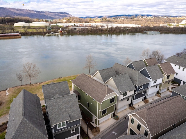 aerial view featuring a water and mountain view