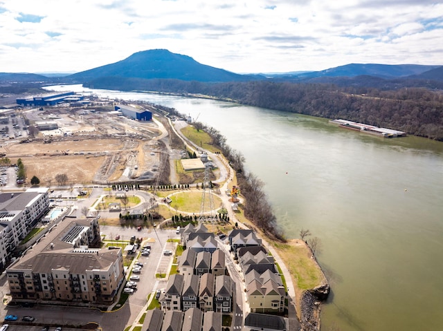 drone / aerial view with a water and mountain view