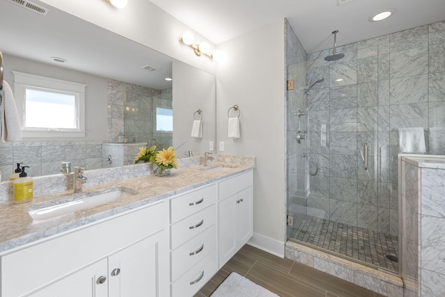 bathroom featuring vanity and walk in shower