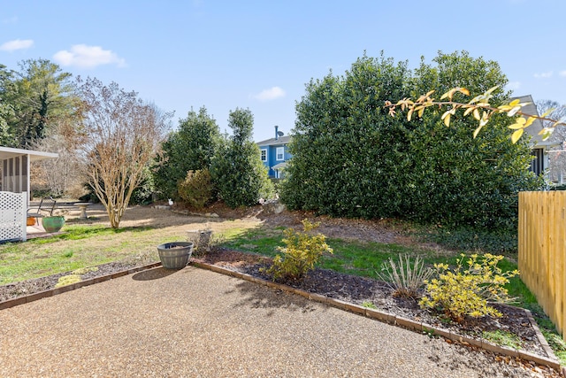 view of yard featuring a patio and fence