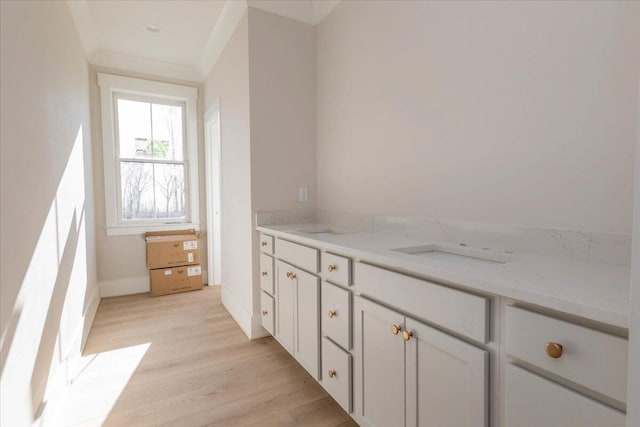 bathroom with vanity and hardwood / wood-style floors