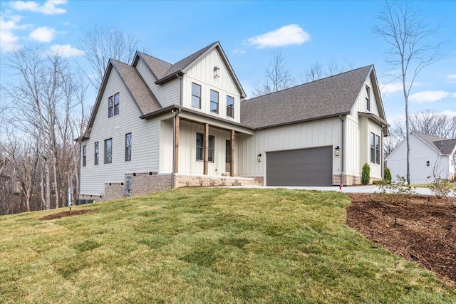 modern inspired farmhouse with board and batten siding, a front lawn, a garage, and a shingled roof