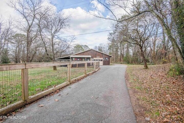 exterior space featuring a garage and an outdoor structure