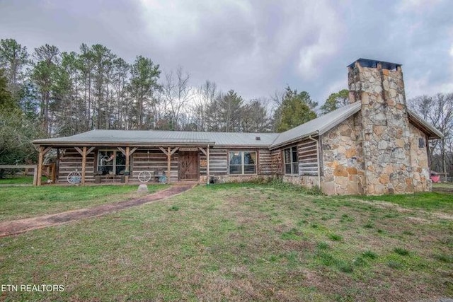 log cabin featuring a front lawn