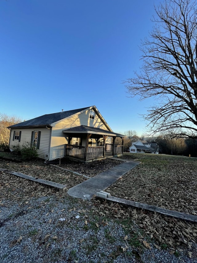 view of property exterior with covered porch