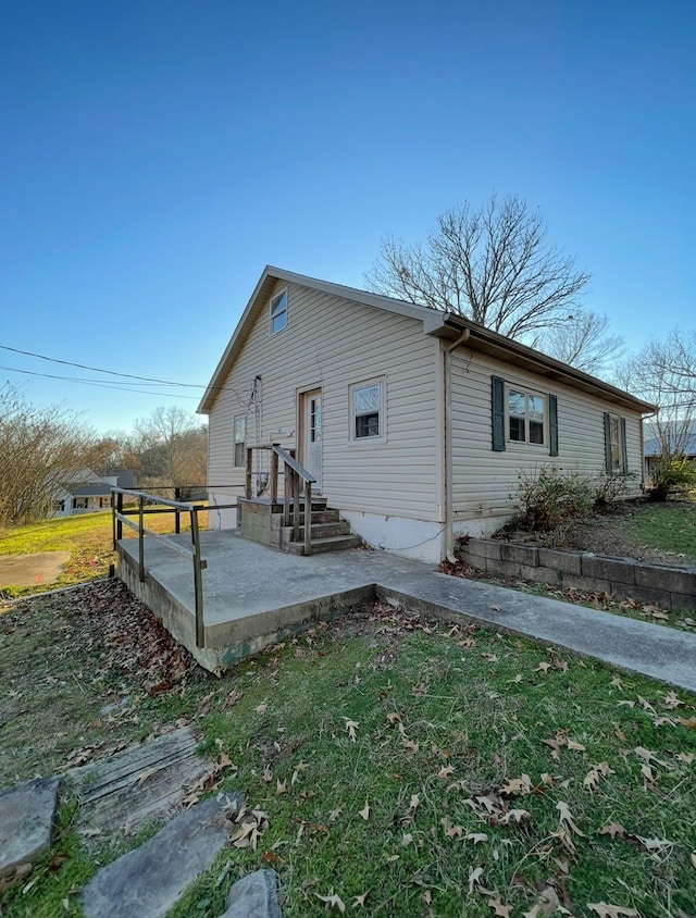 view of property exterior featuring a patio area