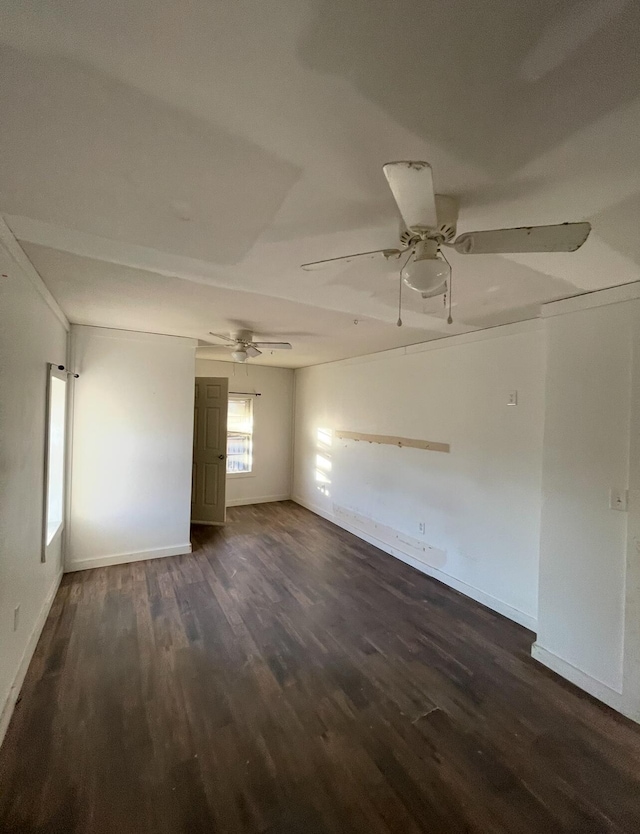 unfurnished room with ceiling fan and dark hardwood / wood-style floors